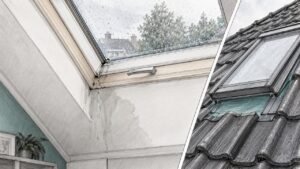 Water druppelt aan de binnenkant van een dakraam naar beneden